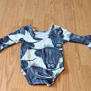 Kids Long Sleeve One-Piece Bodysuit in Navy Cow Print